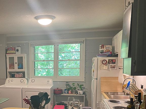 Kitchen includes dishwasher, stove, dishwasher, refrigerator, washer and dryer.