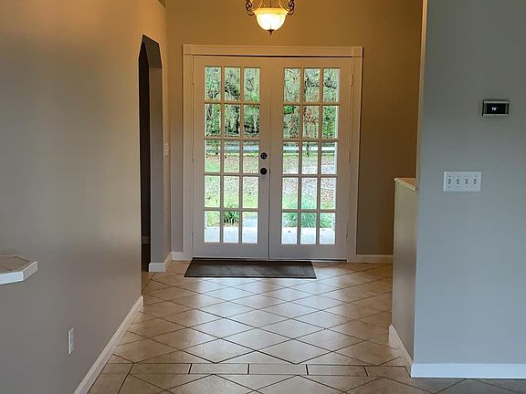 Front Entrance View - Dinning room to the left and Flex Living room or study on the right. Front Doors will be brand new and replaced in Feb/March.