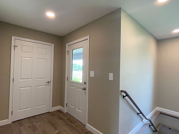 Unit A- Front Door, Coat Closet, and Stair access