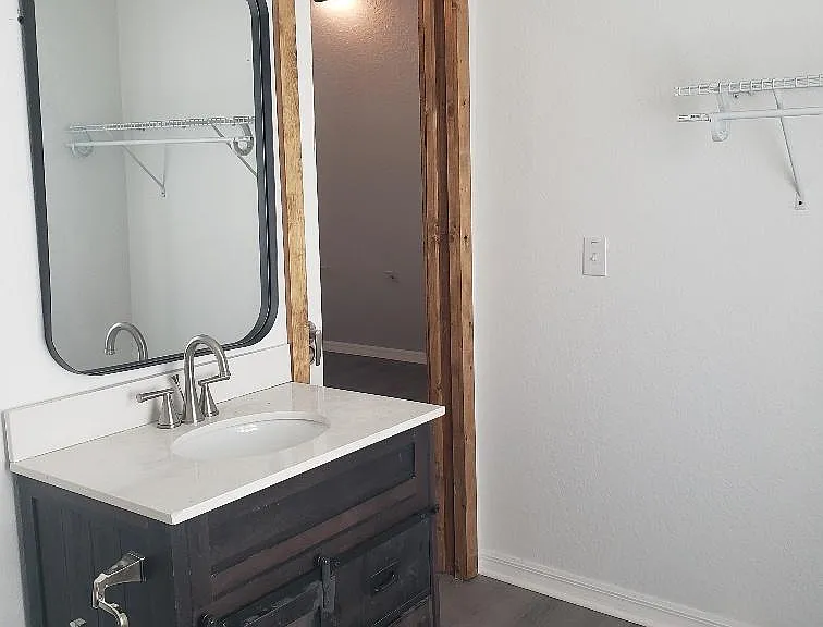 2ND. FLOOR 1/2 BATHROOM WITH A SINK AND TOILET.