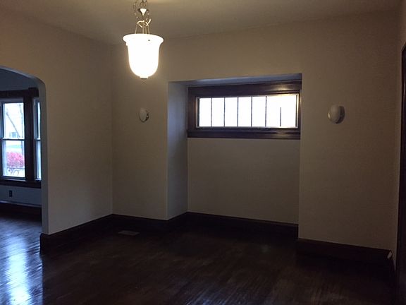 Dining Room also includes wall sconces and horizontal window