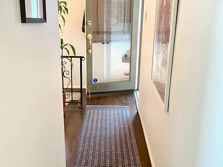 Hallway leading to the peaceful lower level, separated from the main living areas.