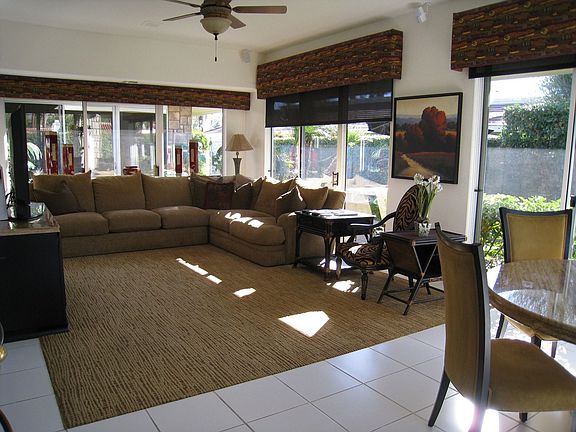 Sunny den/morning room adjoins kitchen.