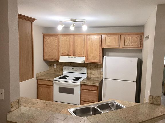 Kitchen with granite tile counters