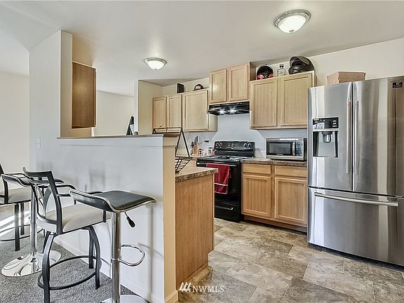 View of kitchen and included appliances. Nice and open to family and dining rooms. 