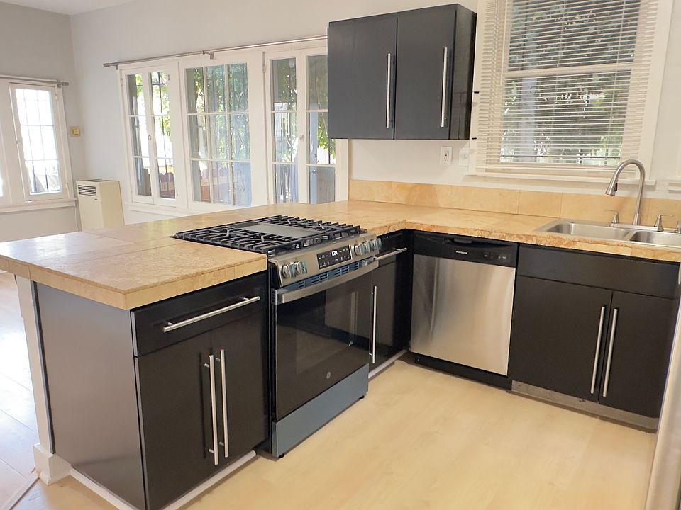 Kitchen and Livingroom view. Wide countertops for meal preparation and countertop seating.