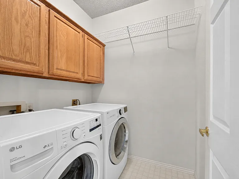 Laundry room with space to hang clothes