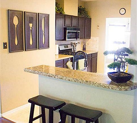 Bar area is just 1 of 3 places where you can enjoy food and drinks in this home