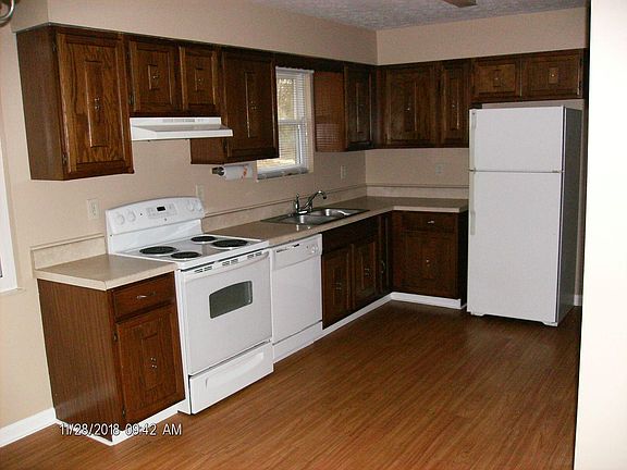 Kitchen with furnished stove, dishwasher, refrigerator