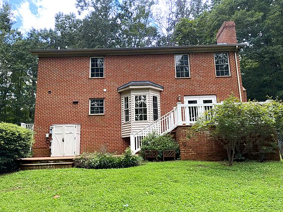 Back of home with double patios - all brick.