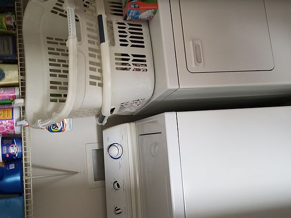 Washer and dryer upstairs betweenbedrooms