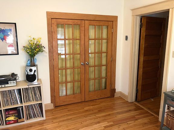 French doors open from the dining room into the Den