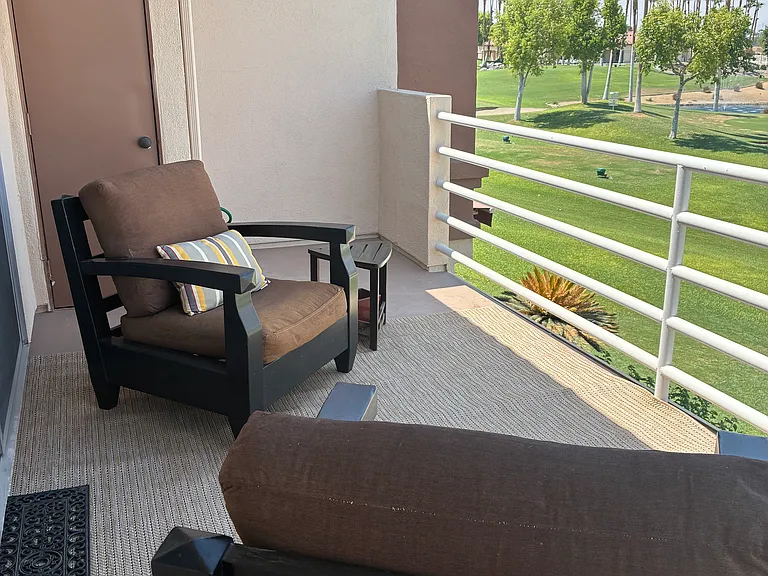 Patio deck overlooking golf course and water