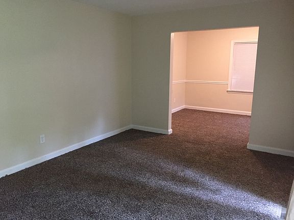 Living room and dining room. Brand new carpet