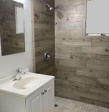 Tile shower and floor.