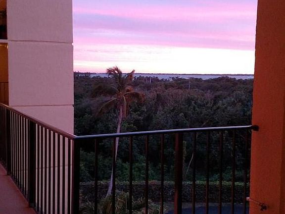 Just outside my front door . Beautiful sunset , you can see the Indian River Lagoon . You can see it a little more inside condo from balcony and kitchen window .