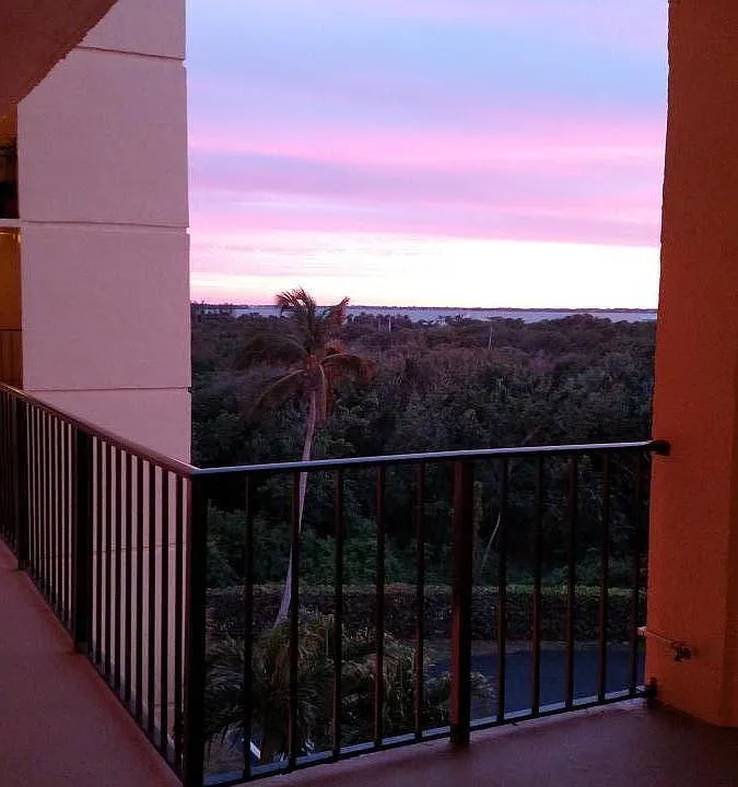 Just outside my front door . Beautiful sunset , you can see the Indian River Lagoon . You can see it a little more inside condo from balcony and kitchen window .