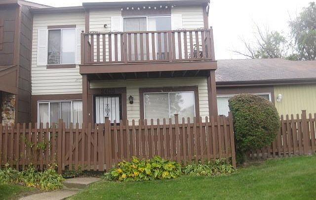 Front Of The Townhouse, Two Balconies.