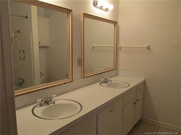 large bathroom with double sinks.