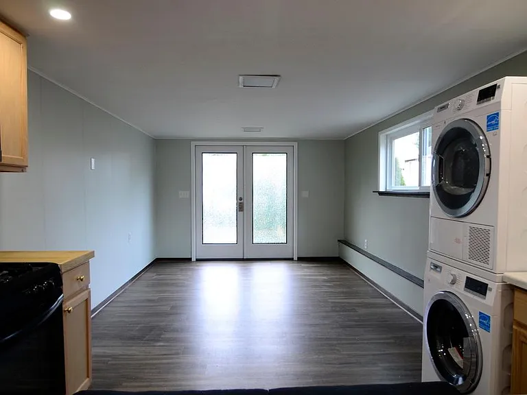 French doors lead to private patio and parking. Newer kitchen with energy efficient washer/dryer.