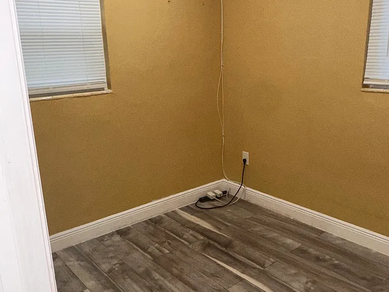 Comfortable bedroom conveniently located next to the oversized bedroom, offering a functional layout.