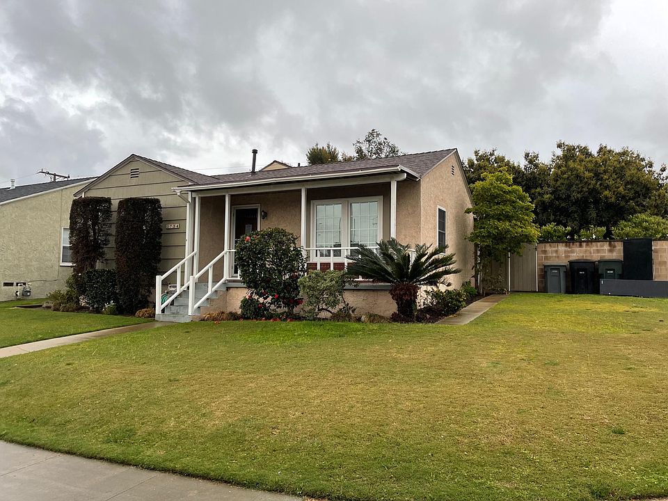 Corner lot with large grassy front yard.