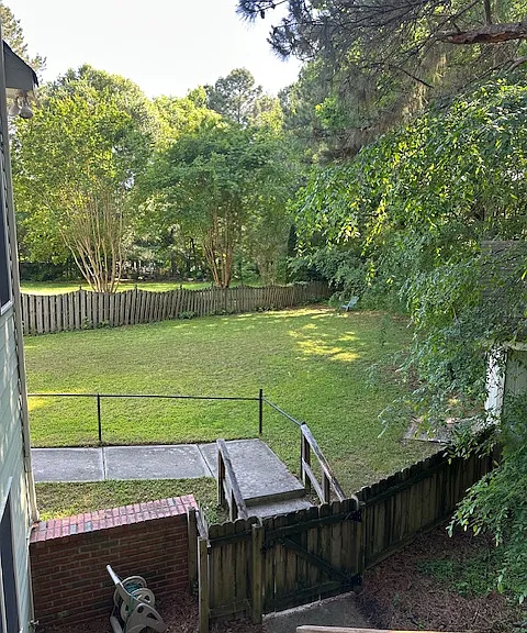 View of gate to yard and entrance to rental