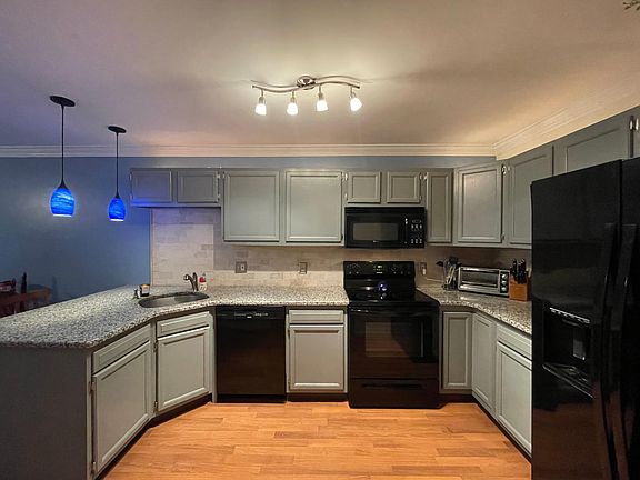 New granite counter tops, backsplash, and lighting