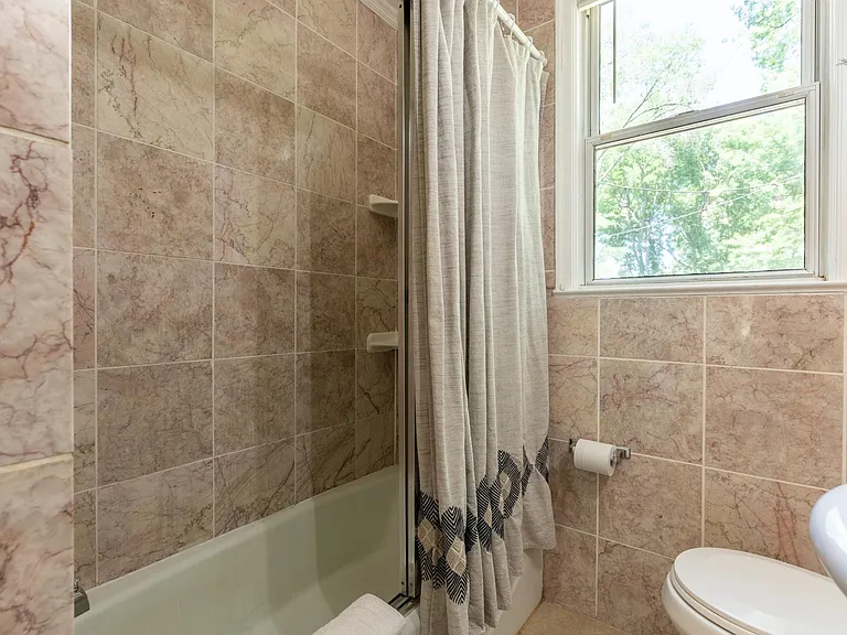 Bathroom has linen closet storage not shown.