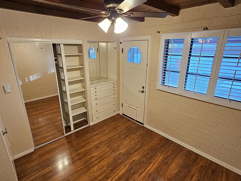 2nd bedroom with door out to backyard