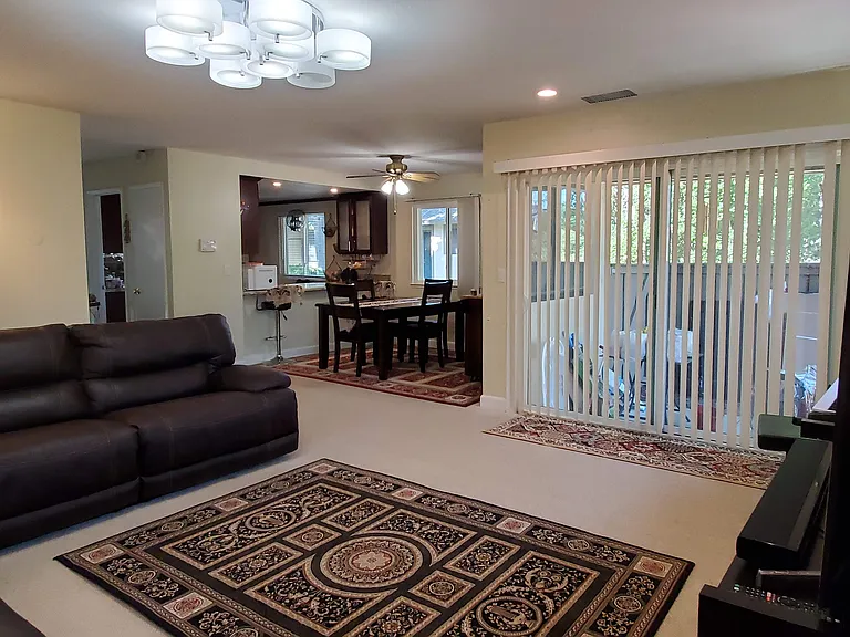 Another view from living room. Includes entrance to side yard