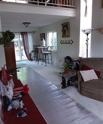 View of living room and dining room from front entry