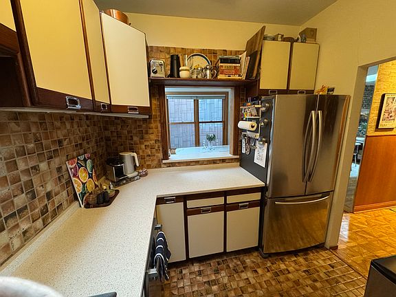 Kitchen w/skylight (facing south west). West wall window opening to the Dining room.