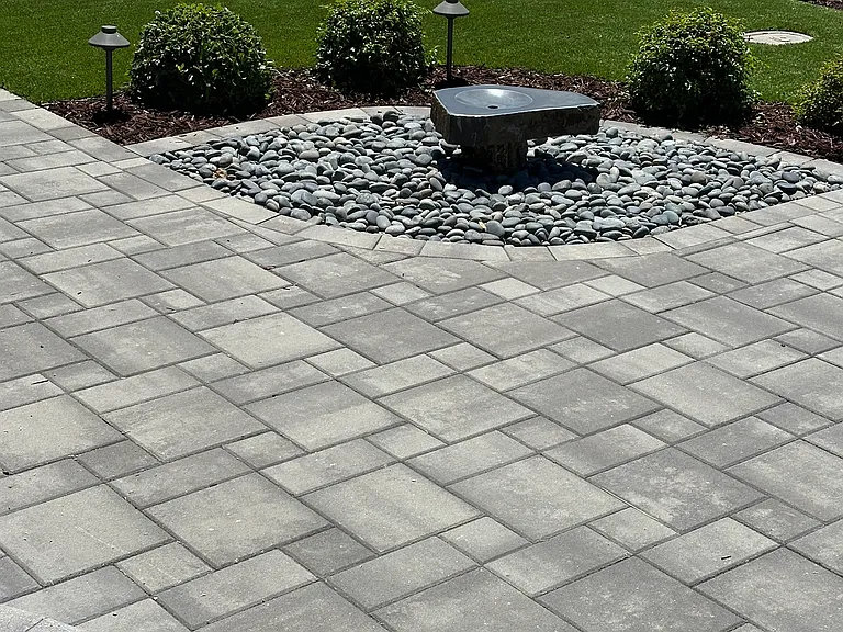 A peaceful fountain welcomes you to the front door