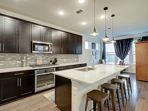 A view of the gourmet style kitchen as seen from living area.