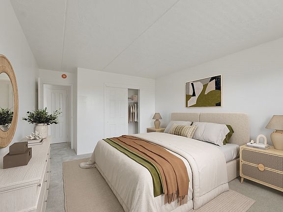 Step into comfort at Patchogue Village at Terry, an Eagle Rock Community. This inviting bedroom blends modern design with tranquil vibes, creating the perfect retreat. Ready to find your new home? Explore your options today!