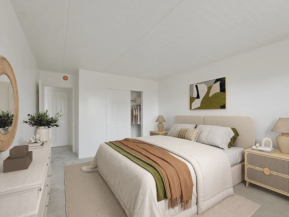 Step into comfort at Patchogue Village at Terry, an Eagle Rock Community. This inviting bedroom blends modern design with tranquil vibes, creating the perfect retreat. Ready to find your new home? Explore your options today!