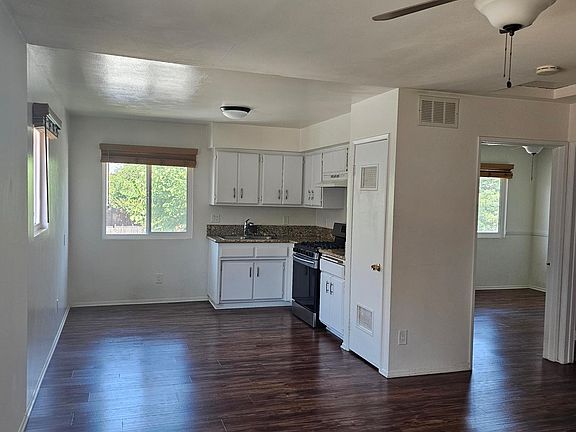 View from entry door into Living Room. Open space concept to kitchen