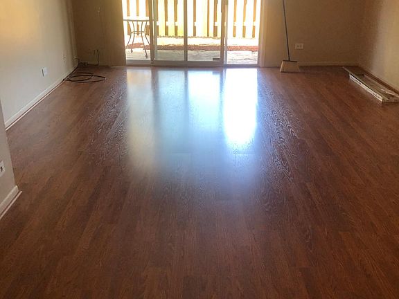 Laminated flooring throughout entire house except bathroom