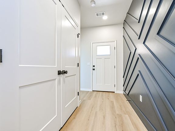 Front entry with washer and dryer hookups in doors on left