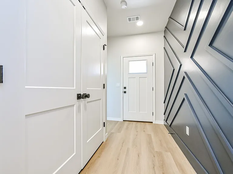 Front entry with washer and dryer hookups in doors on left