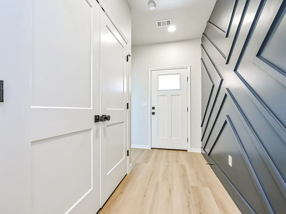 Front entry with washer and dryer hookups in doors on left
