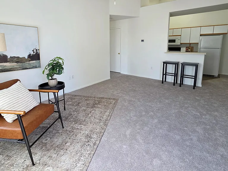 This expansive living area offers the perfect blend of comfort and functionality. Thoughtfully designed with ample natural light and an open layout, it's an ideal setting for both everyday living and hosting guests.
