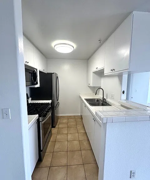 Bright kitchen with stainless steel appliances