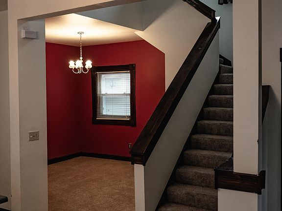 Dining room and stairway to lofted open concept second bedroom
