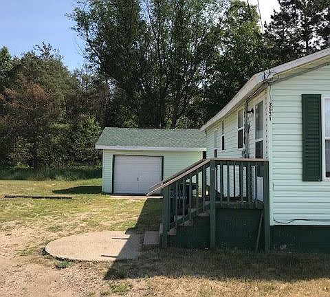 Side of House and Oversized Garage