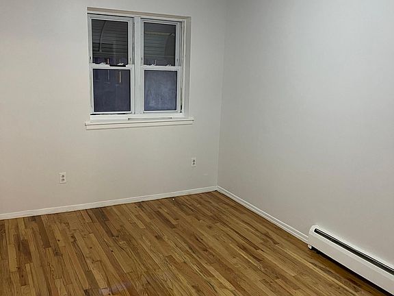 Bedroom #1 with closet and view of park.