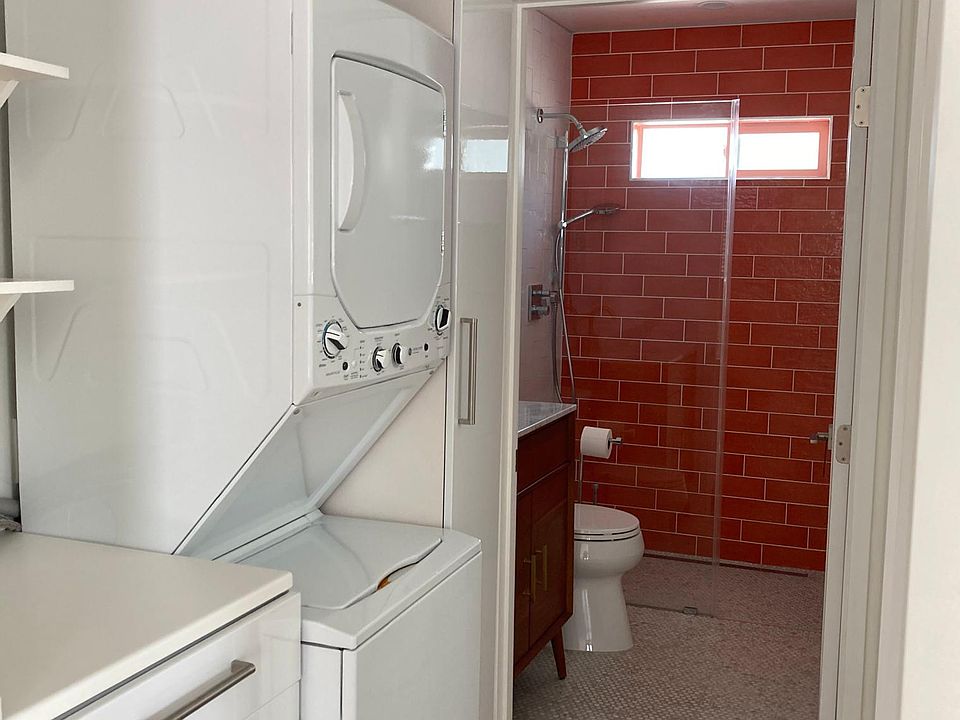 Designated laundry area. Washer and dryer unit. Bottom cabinet and folding area. Broom closet, pantry, and overhead storage.