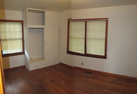 Bedroom 1 with hardwood floors