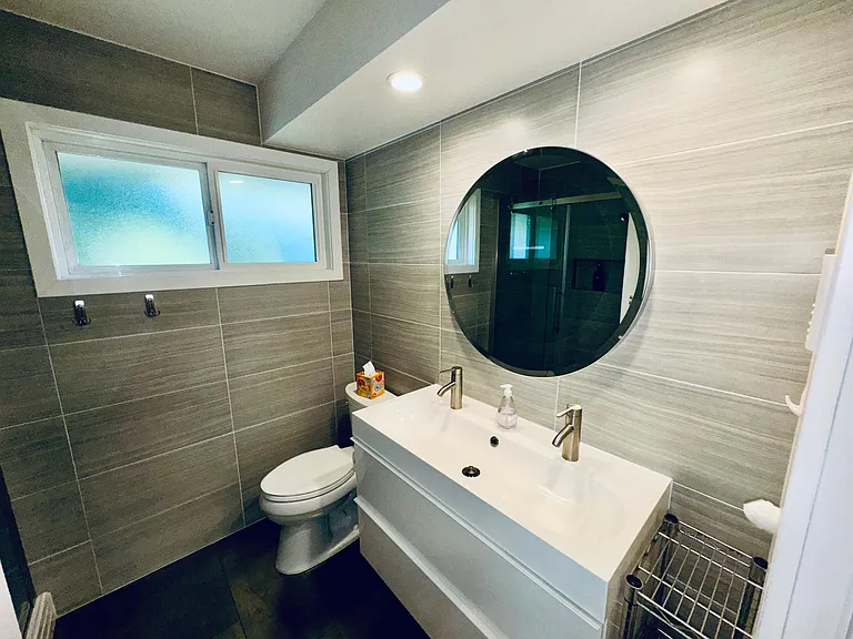 Dual lav, heated tile flooring and Kohler toilet.